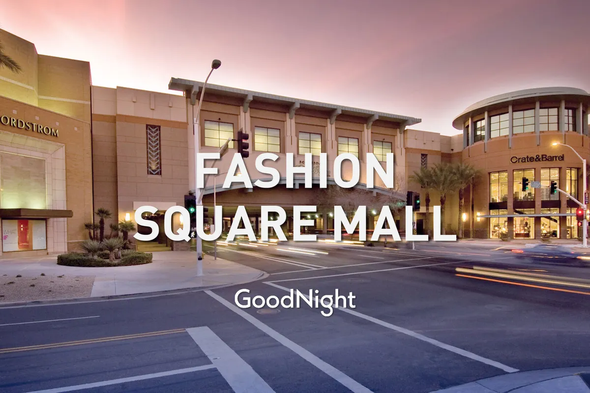 The well-lit entrance of the Nordstrom store and Crate & Barrel storefront set against palm trees and streetlights. The area is inviting, lively, and perfect for people-watching, shopping, or enjoying a meal at nearby restaurants.