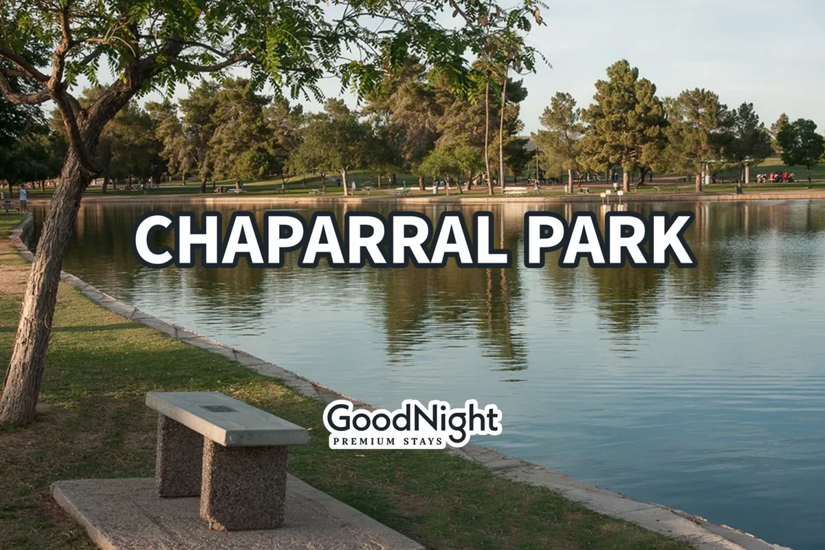 This image features a tranquil lakeside scene with trees and a park bench set along the shoreline, ideal for leisurely walks or relaxed afternoons. The atmosphere is peaceful, and the setting sun casts a warm glow over the water, inviting visitors to unwind in nature.